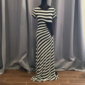 Super sexy form fitting maxi dress from ECI is black and white striped w/ruching